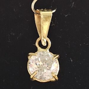 Elegant Gold Pendant with Crystal Accent